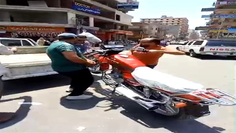 ضبط دراجة نارية