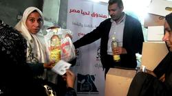 توزيع 9400 كرتونة مواد غذائية بسوهاج