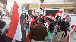 الأطفال يحملون أعلام مصر أمام اللجان الانتخابية في فيصل والهرم