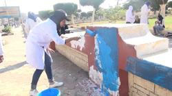 بالصور| طالبات السويس ينفذن مبادرة لطلاء أسوار الحدائق باللون الأزرق