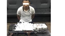 ضبط عاطل بحوزته كيلو هيروين وسلاح ناري بالخانكة