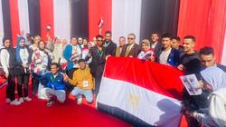 طلاب جامعات يزينون لجان أكتوبر بالأعلام في اليوم الأخير للانتخابات الرئاسية