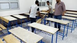 متطوعون يجهزون مبنى ملحق بمدرسة في دمياط للوقاية من كورونا