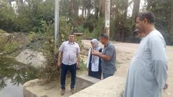 تطهير المجاري المائية وإزالة المخلفات بالترع والمصارف في أسيوط