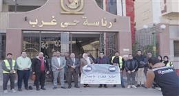 أمين «مستقبل وطن سوهاج» يشهد توزيع كراتين مواد غذائية على عمال النظافة بحي غرب