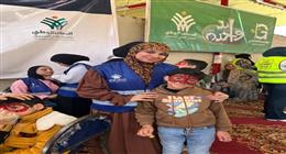 عضو التحالف الوطني تشارك في قافلة «إيد واحدة» ببورسعيد بمعرض ملابس مجاني